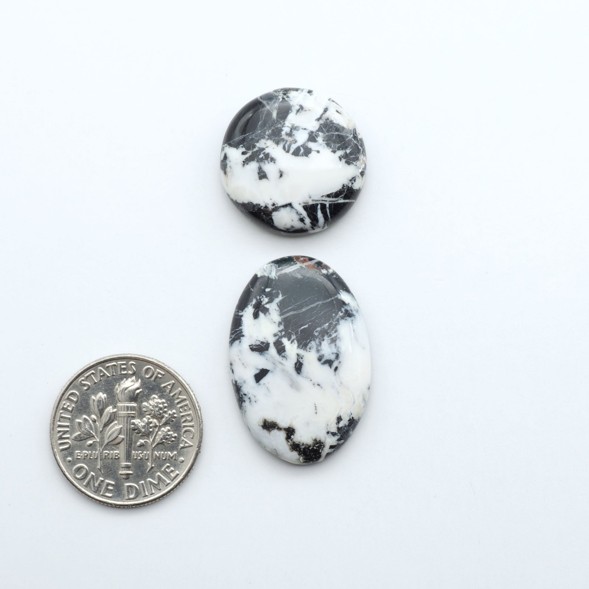 Natural White Buffalo Stone Cabochons are semi-precious gemstones cut into shapes ideal for jewelry-making, making them an excellent choice for artisans.
