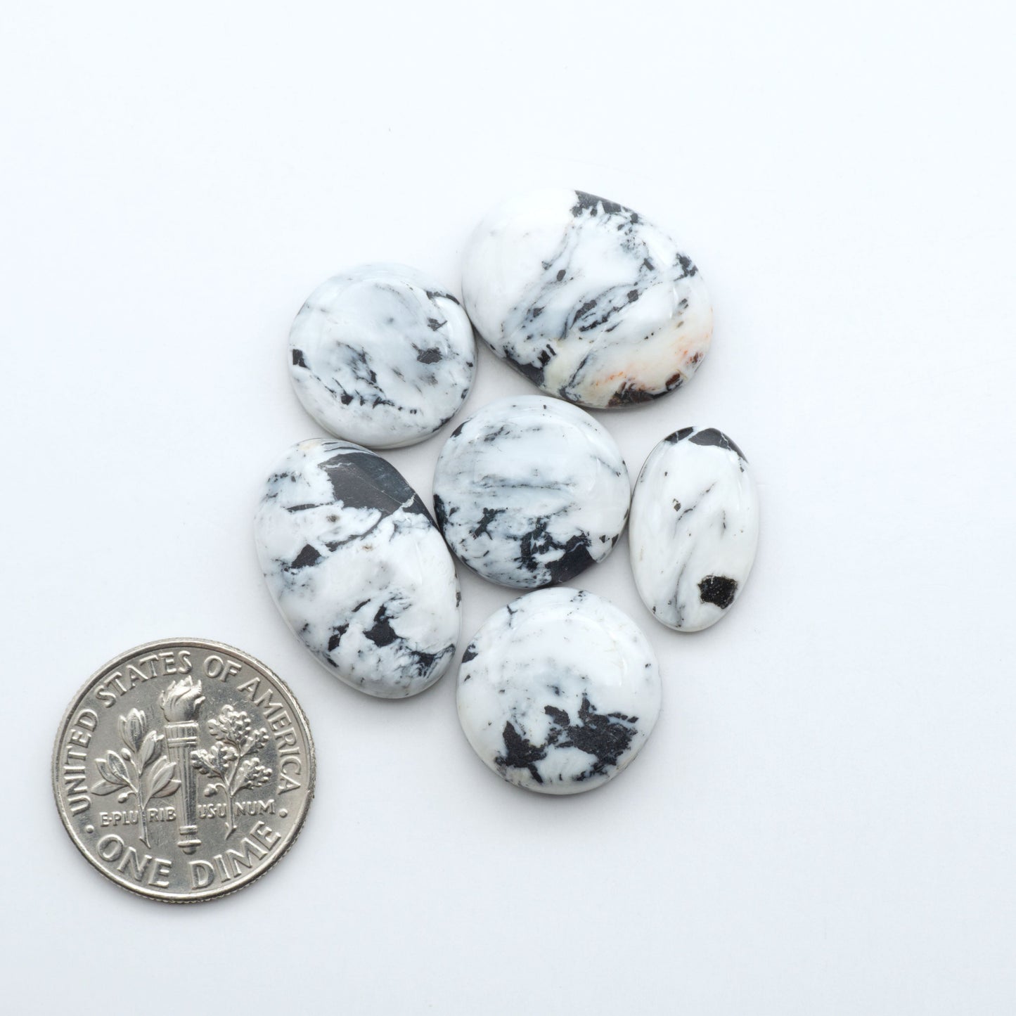 Natural White Buffalo Stone Cabochons are semi-precious gemstones cut into shapes ideal for jewelry-making, making them an excellent choice for artisans.