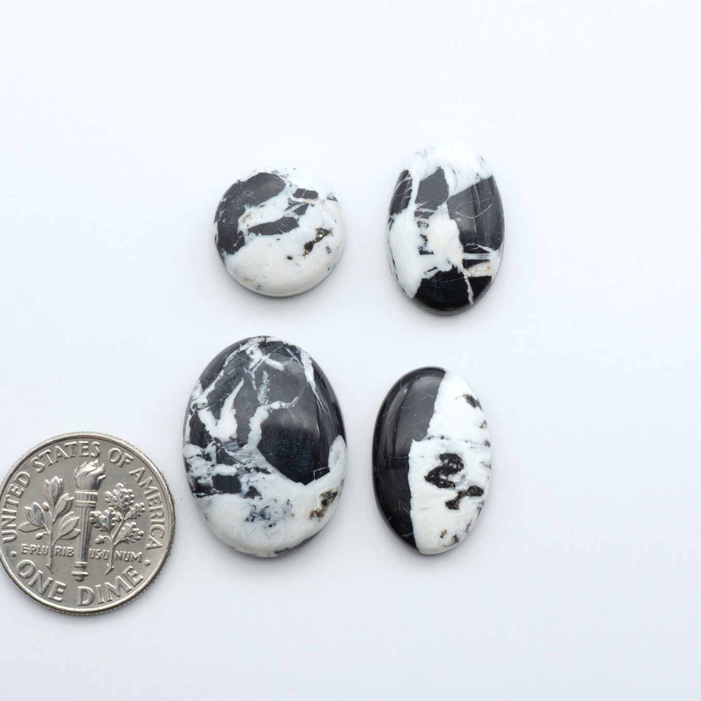 Natural White Buffalo Stone Cabochons are semi-precious gemstones cut into shapes ideal for jewelry-making, making them an excellent choice for artisans.