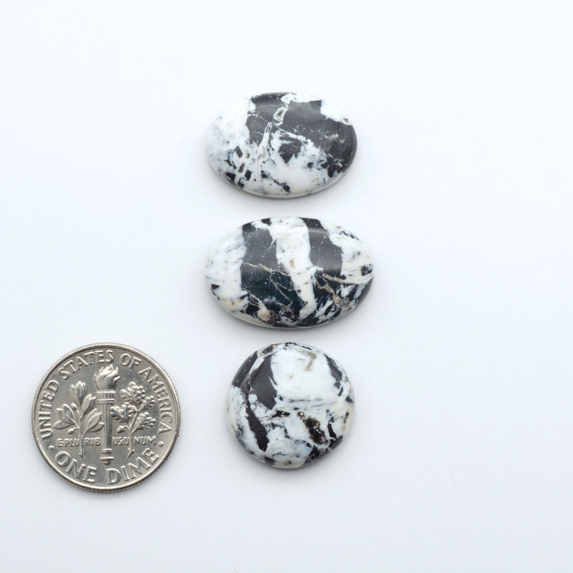 Natural White Buffalo Stone Cabochons are semi-precious gemstones cut into shapes ideal for jewelry-making, making them an excellent choice for artisans.