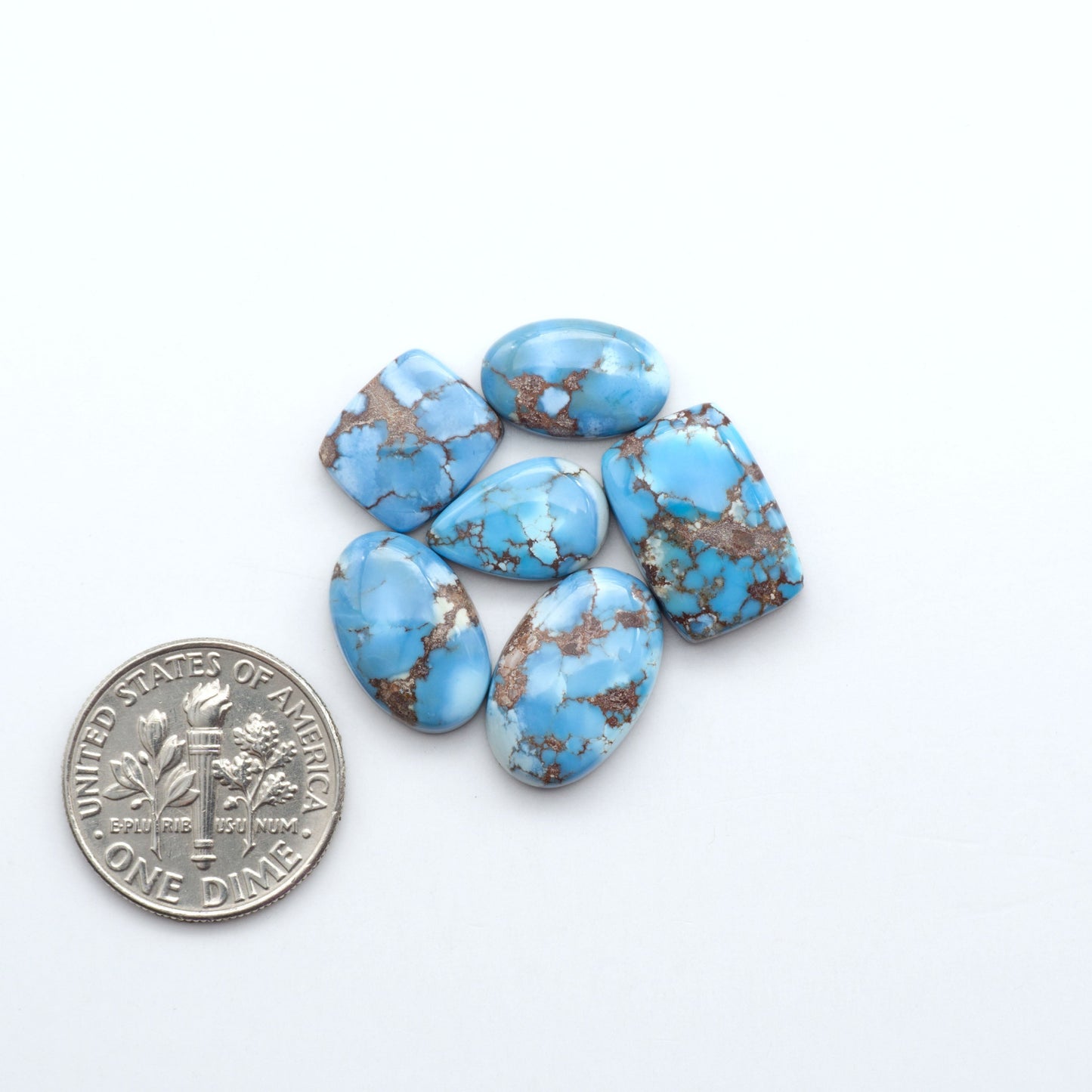 Discover the beauty of Natural Golden Hills Turquoise—prized for its icy blue tones, golden matrix, and exceptional quality. Ideal for artisan jewelry designs.