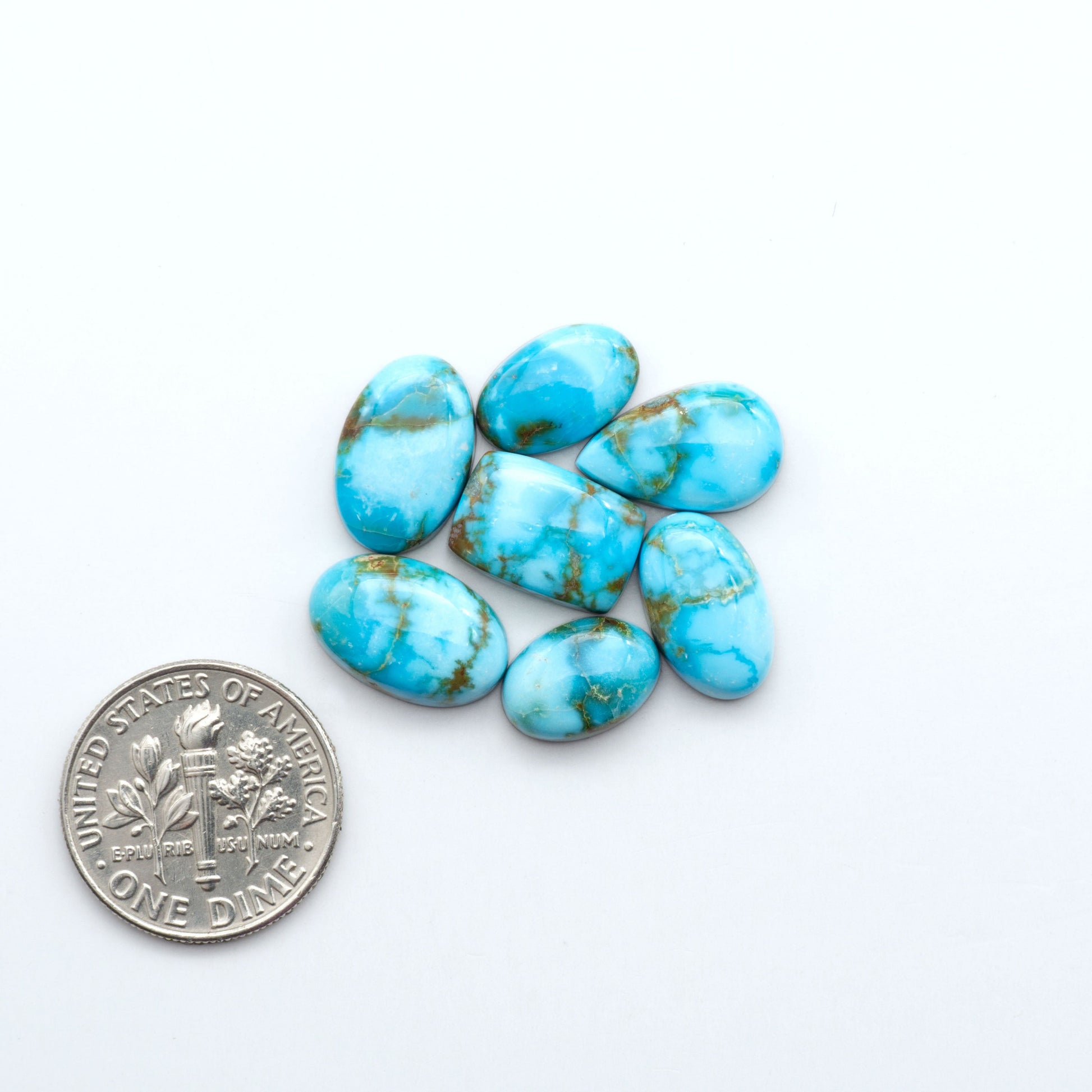 Kingman Turquoise Cabochons are a staple in the jewelry industry, known for their stunning blue-green color. Perfect for necklaces, earrings, and more!