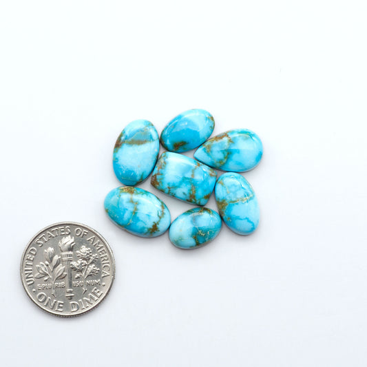 Kingman Turquoise Cabochons are a staple in the jewelry industry, known for their stunning blue-green color. Perfect for necklaces, earrings, and more!