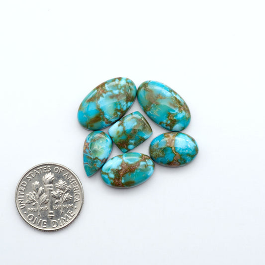 Kingman Turquoise Cabochons are a staple in the jewelry industry, known for their stunning blue-green color. Perfect for necklaces, earrings, and more!