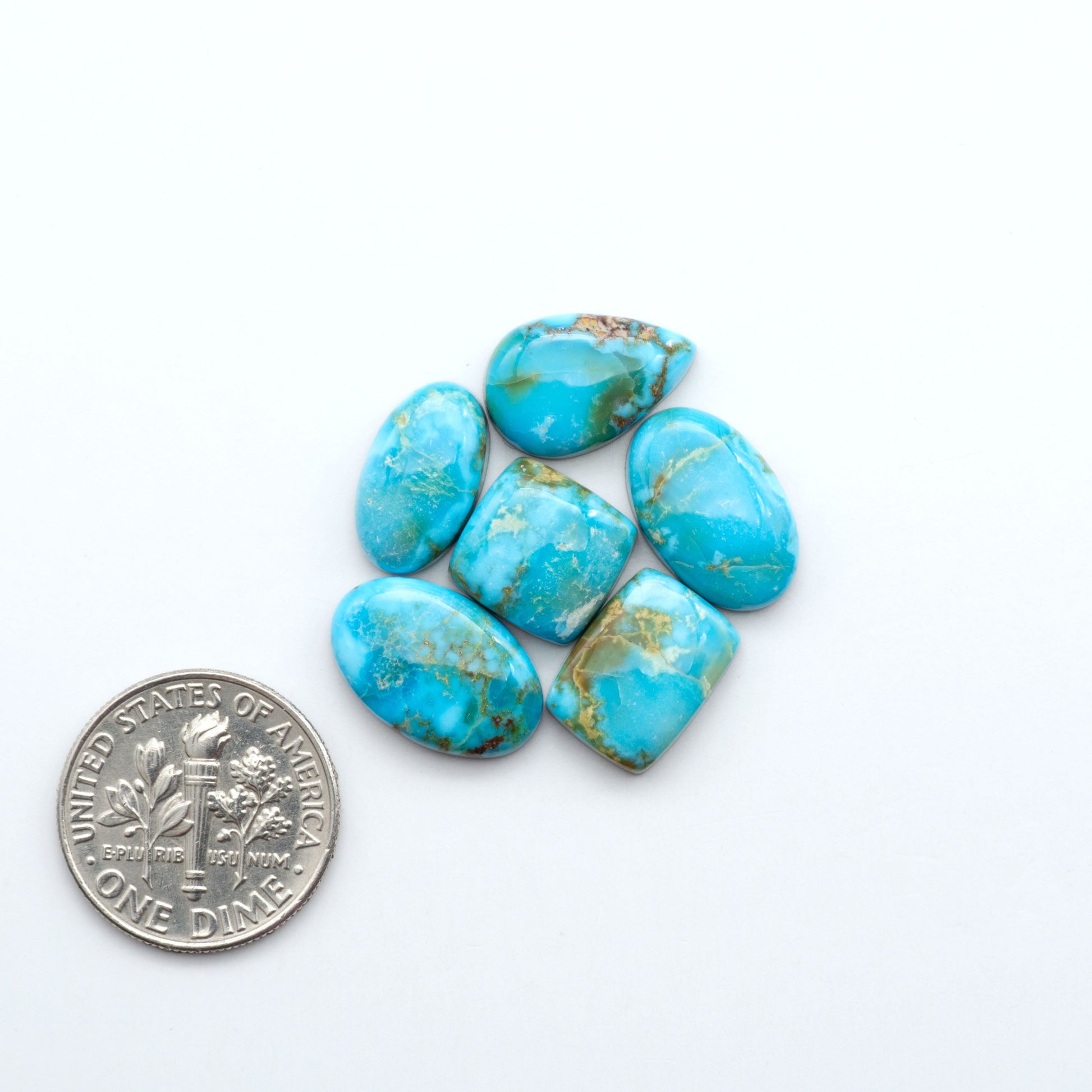 Kingman Turquoise Cabochons are a staple in the jewelry industry, known for their stunning blue-green color. Perfect for necklaces, earrings, and more!