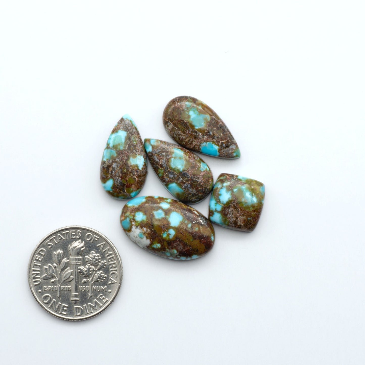 Kingman Turquoise Cabochons are a staple in the jewelry industry, known for their stunning blue-green color. Perfect for necklaces, earrings, and more!