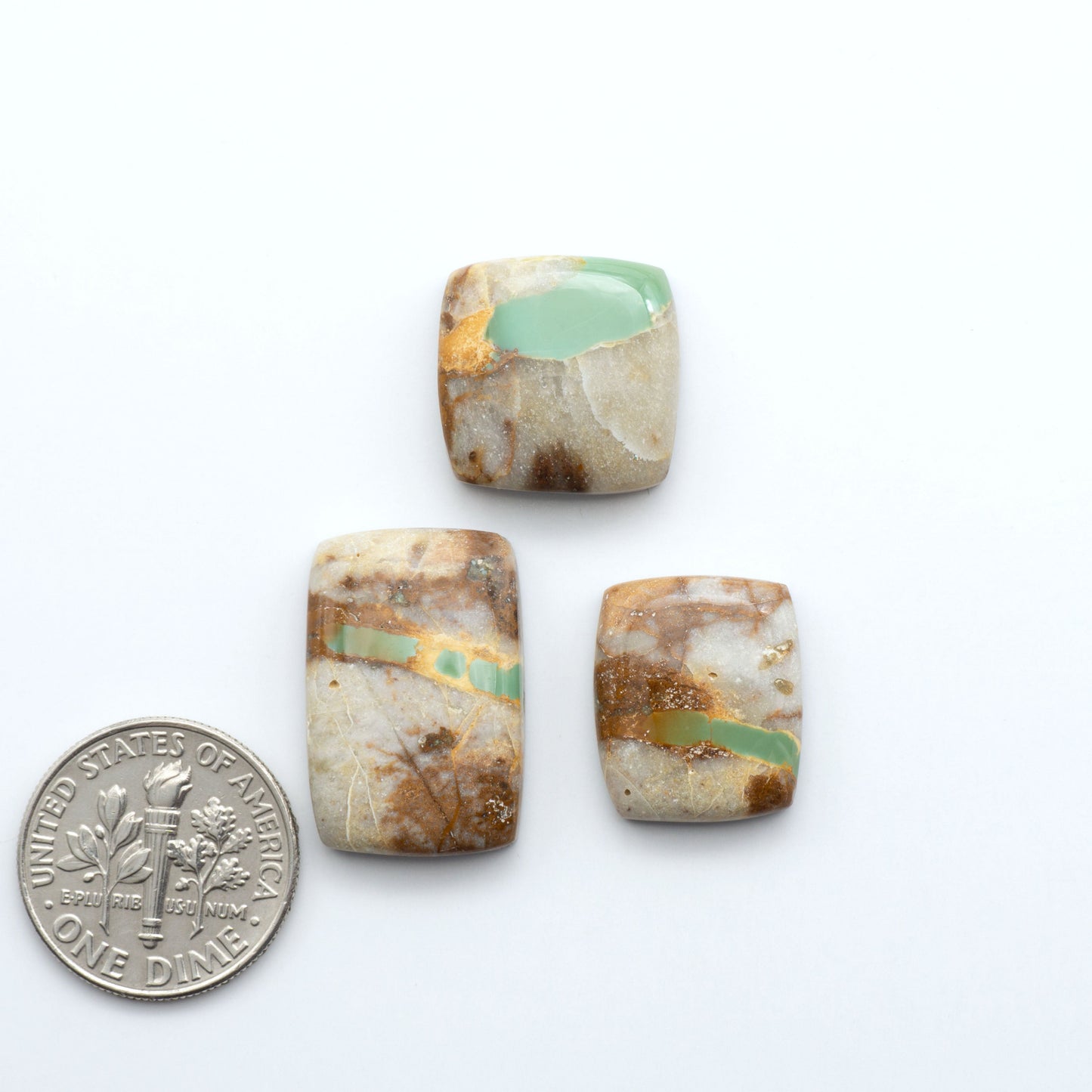 Royston Turquoise cabochons are famous for their distinctive matrix and unique green and blue hues, making them a favored option among jewelry designers.