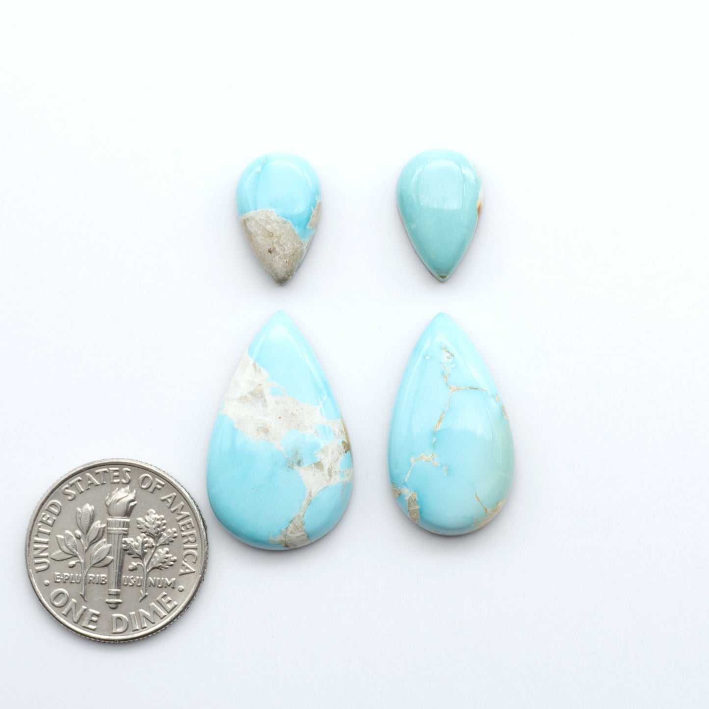 Royston Turquoise cabochons are famous for their distinctive matrix and unique green and blue hues, making them a favored option among jewelry designers.
