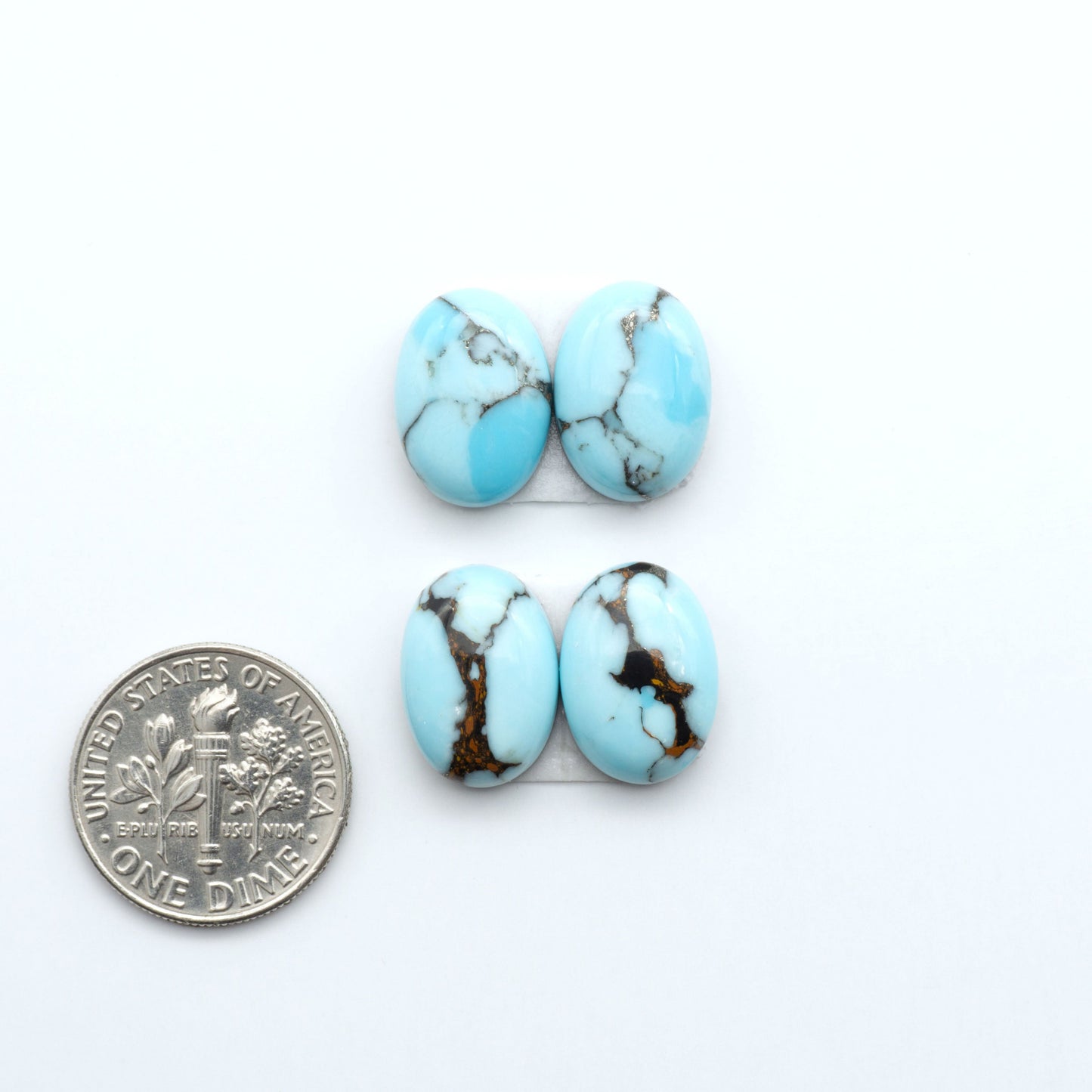 Enhance your jewelry designs with Pressed Turquoise Nugget Cabochons. Crafted from composite materials they add a captivating touch to your creations.
