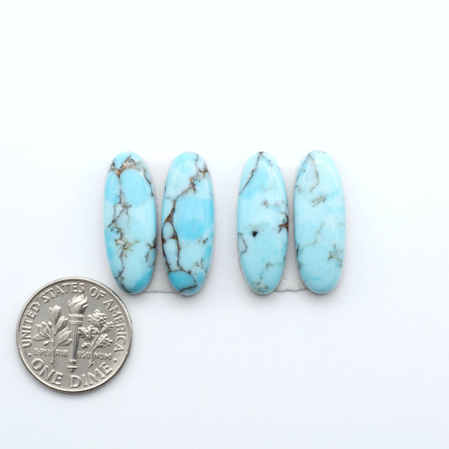 Enhance your jewelry designs with Pressed Turquoise Nugget Cabochons. Crafted from composite materials they add a captivating touch to your creations.