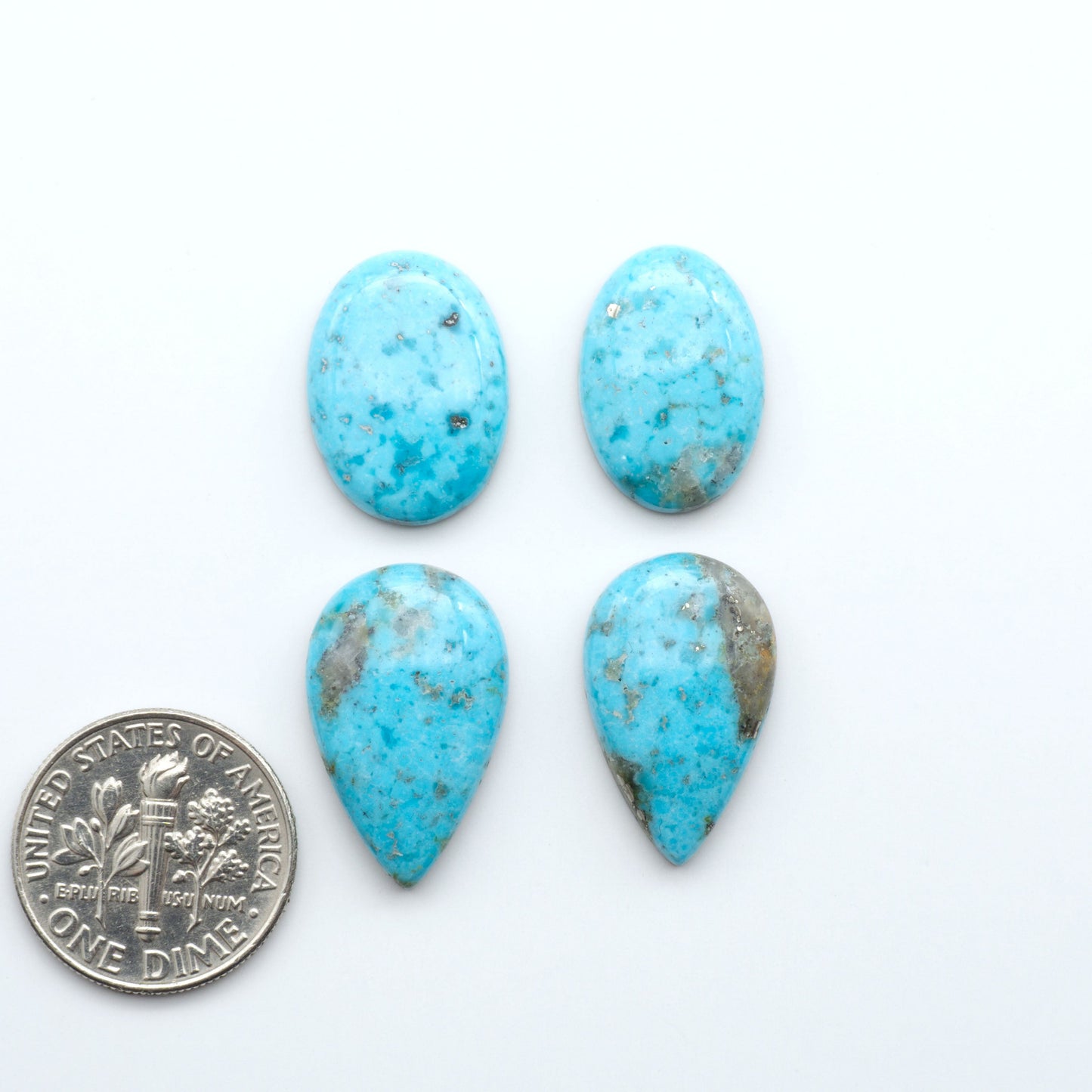 Nacozari turquoise cabochons are striking gemstones known for their vibrant blue to greenish-blue colors and pyrite, these stones are prized in jewelry making.