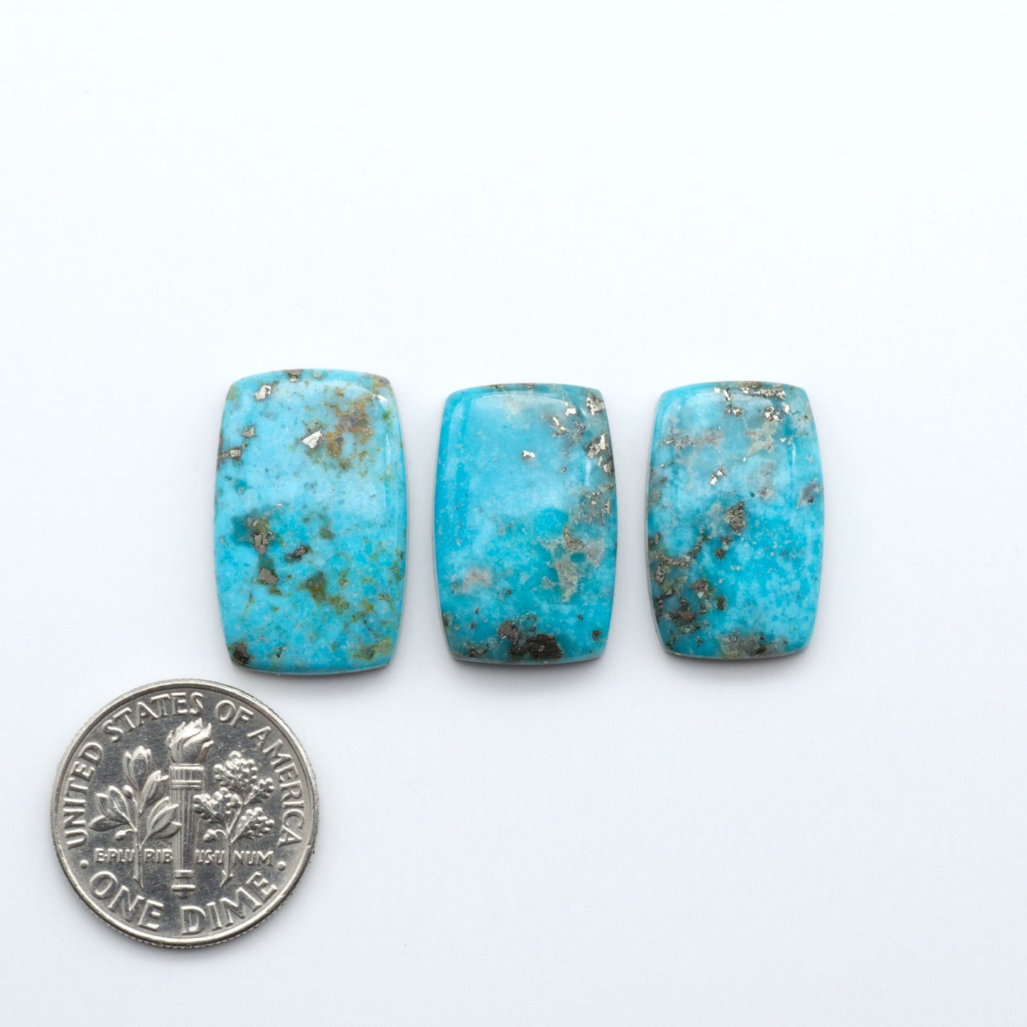 Nacozari turquoise cabochons are striking gemstones known for their vibrant blue to greenish-blue colors and pyrite, these stones are prized in jewelry making.