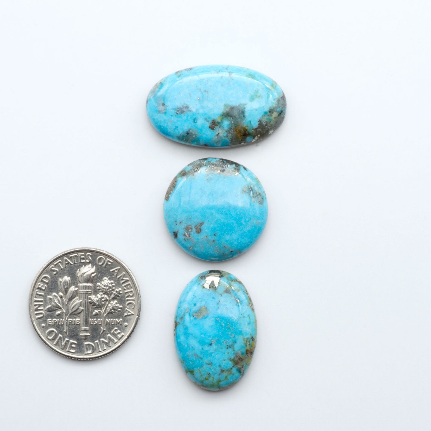 Nacozari turquoise cabochons are striking gemstones known for their vibrant blue to greenish-blue colors and pyrite, these stones are prized in jewelry making.