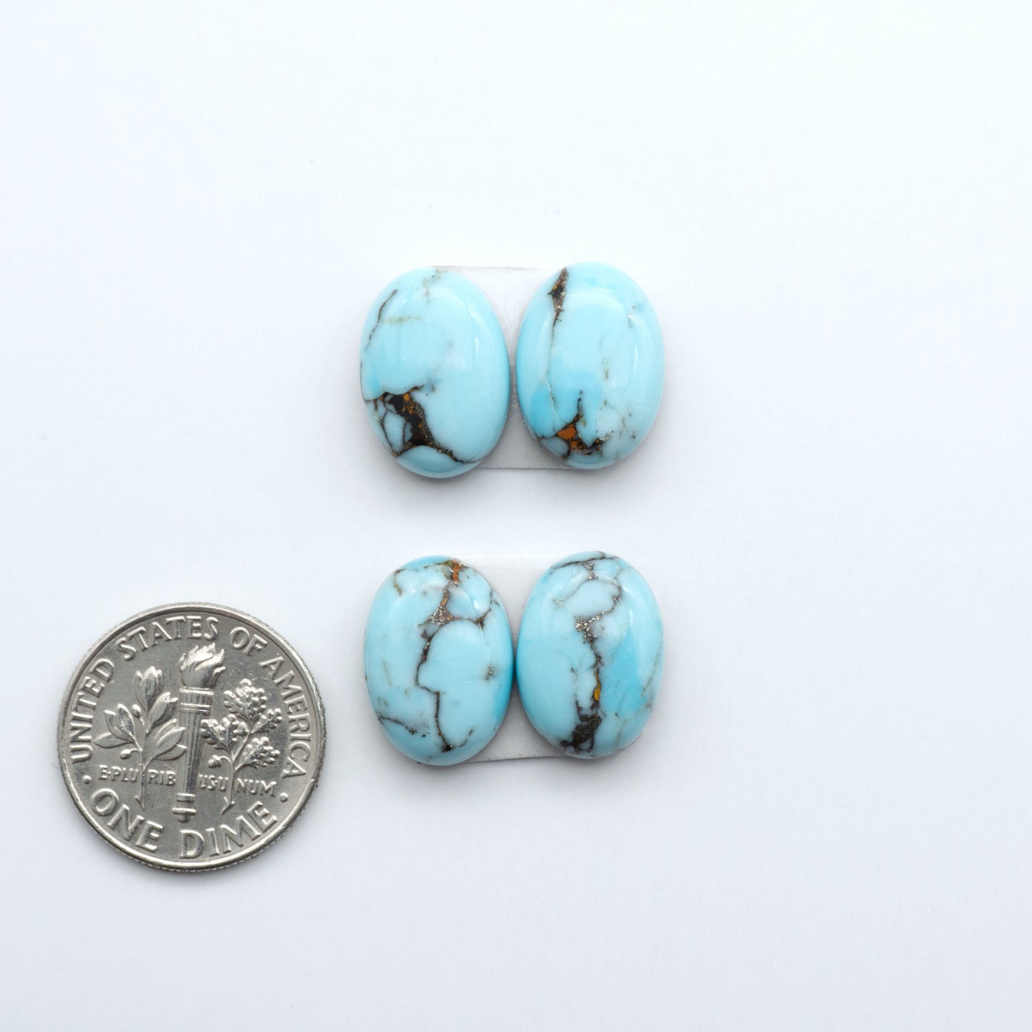 Enhance your jewelry designs with Pressed Turquoise Nugget Cabochons. Crafted from composite materials they add a captivating touch to your creations.