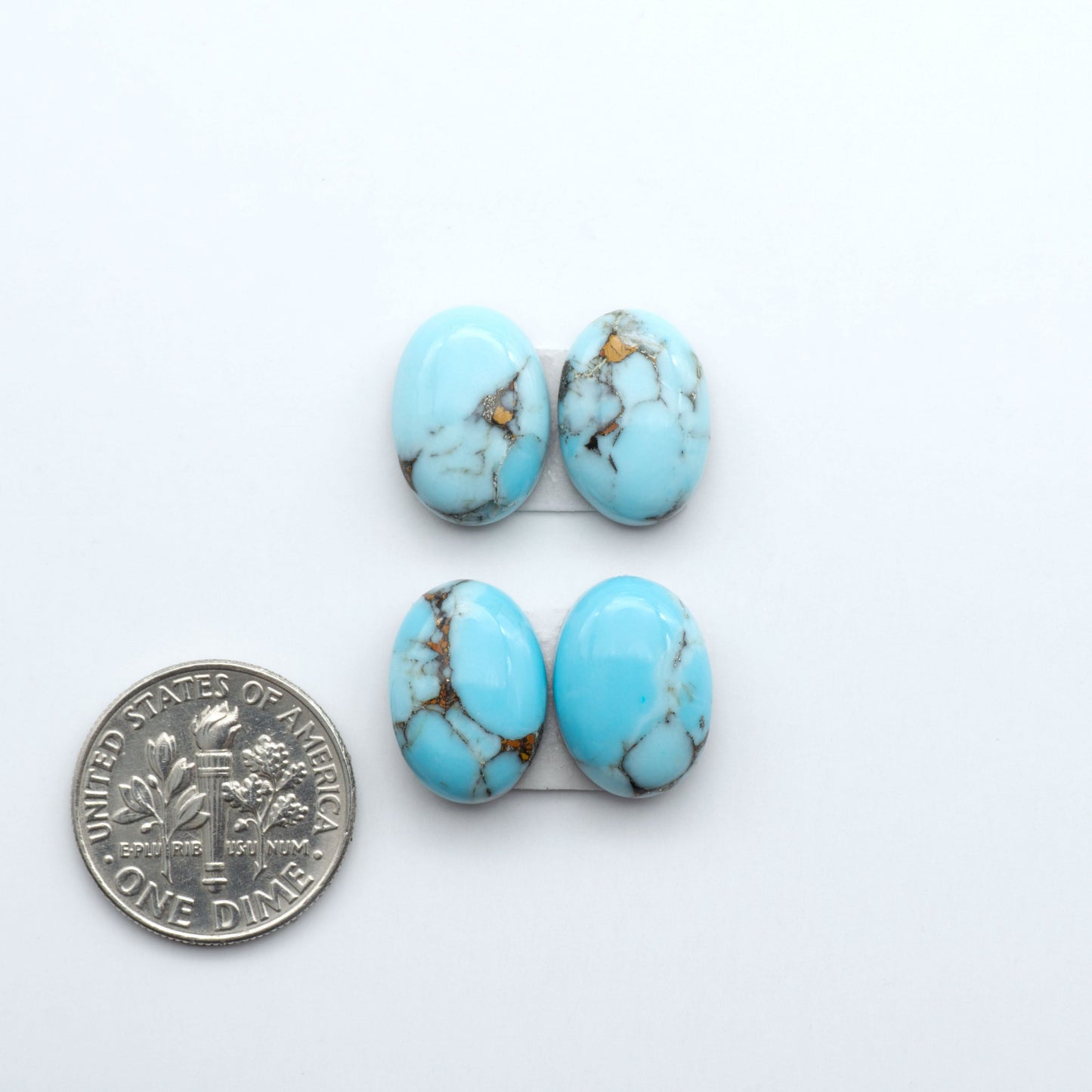 Enhance your jewelry designs with Pressed Turquoise Nugget Cabochons. Crafted from composite materials they add a captivating touch to your creations.