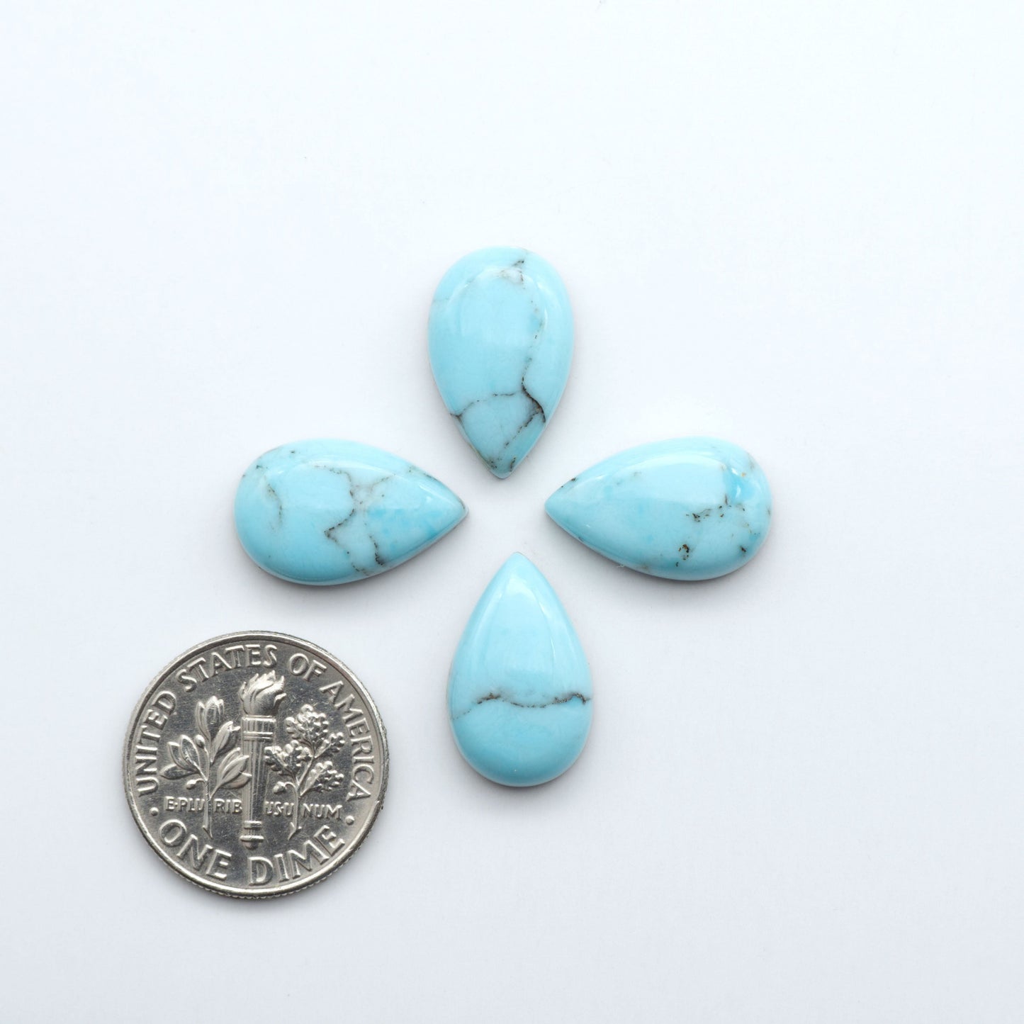 Enhance your jewelry designs with Pressed Turquoise Nugget Cabochons. Crafted from composite materials they add a captivating touch to your creations.
