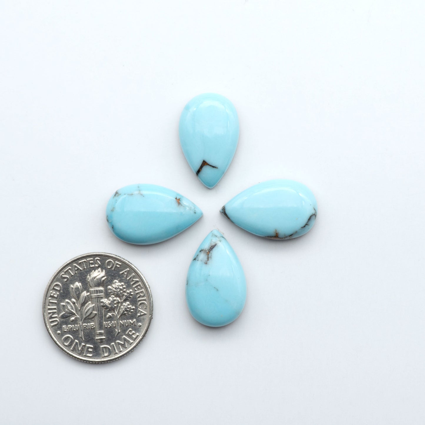 Enhance your jewelry designs with Pressed Turquoise Nugget Cabochons. Crafted from composite materials they add a captivating touch to your creations.