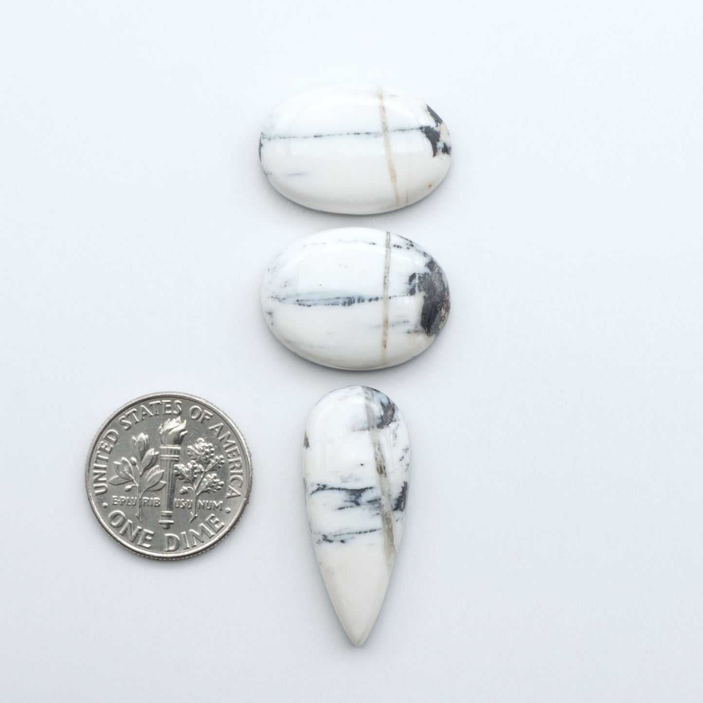 Natural White Buffalo Stone Cabochons are semi-precious gemstones cut into shapes ideal for jewelry-making, making them an excellent choice for artisans.