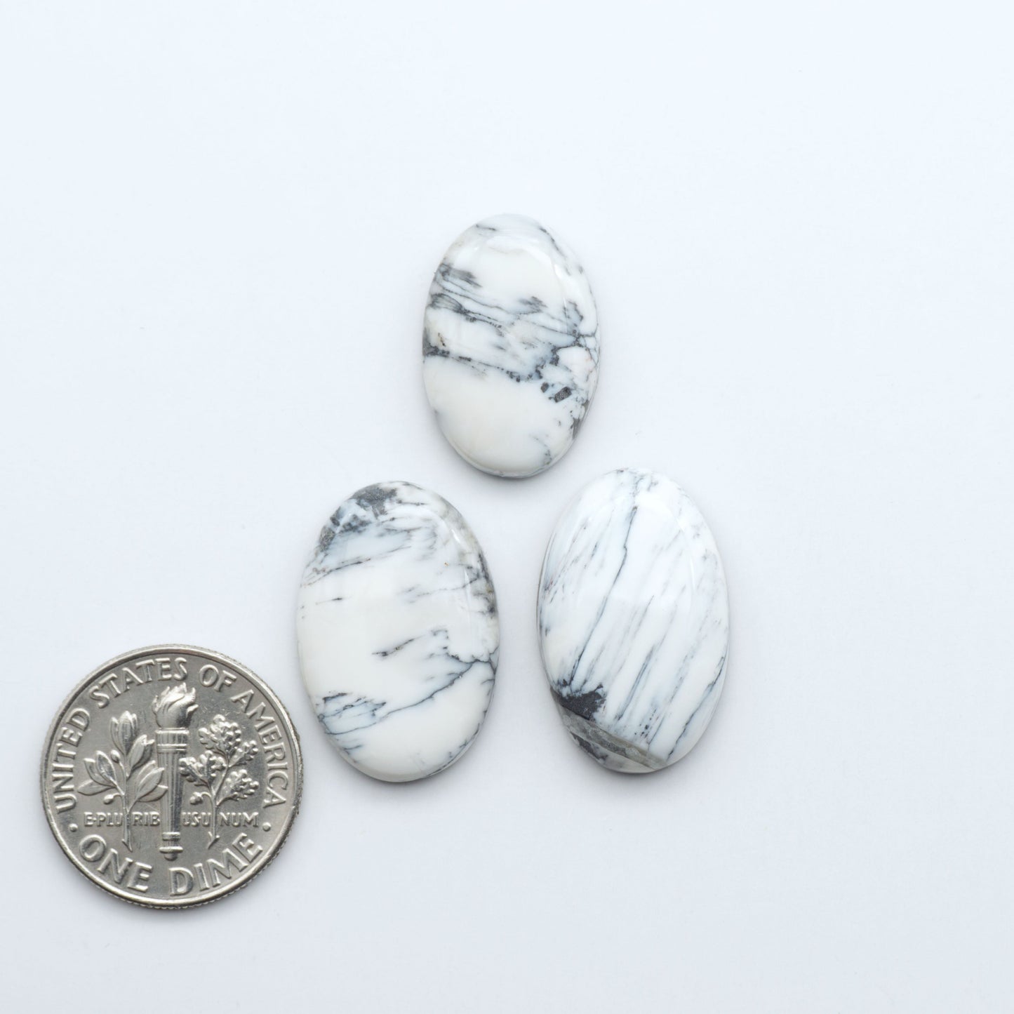 Natural White Buffalo Stone Cabochons are semi-precious gemstones cut into shapes ideal for jewelry-making, making them an excellent choice for artisans.