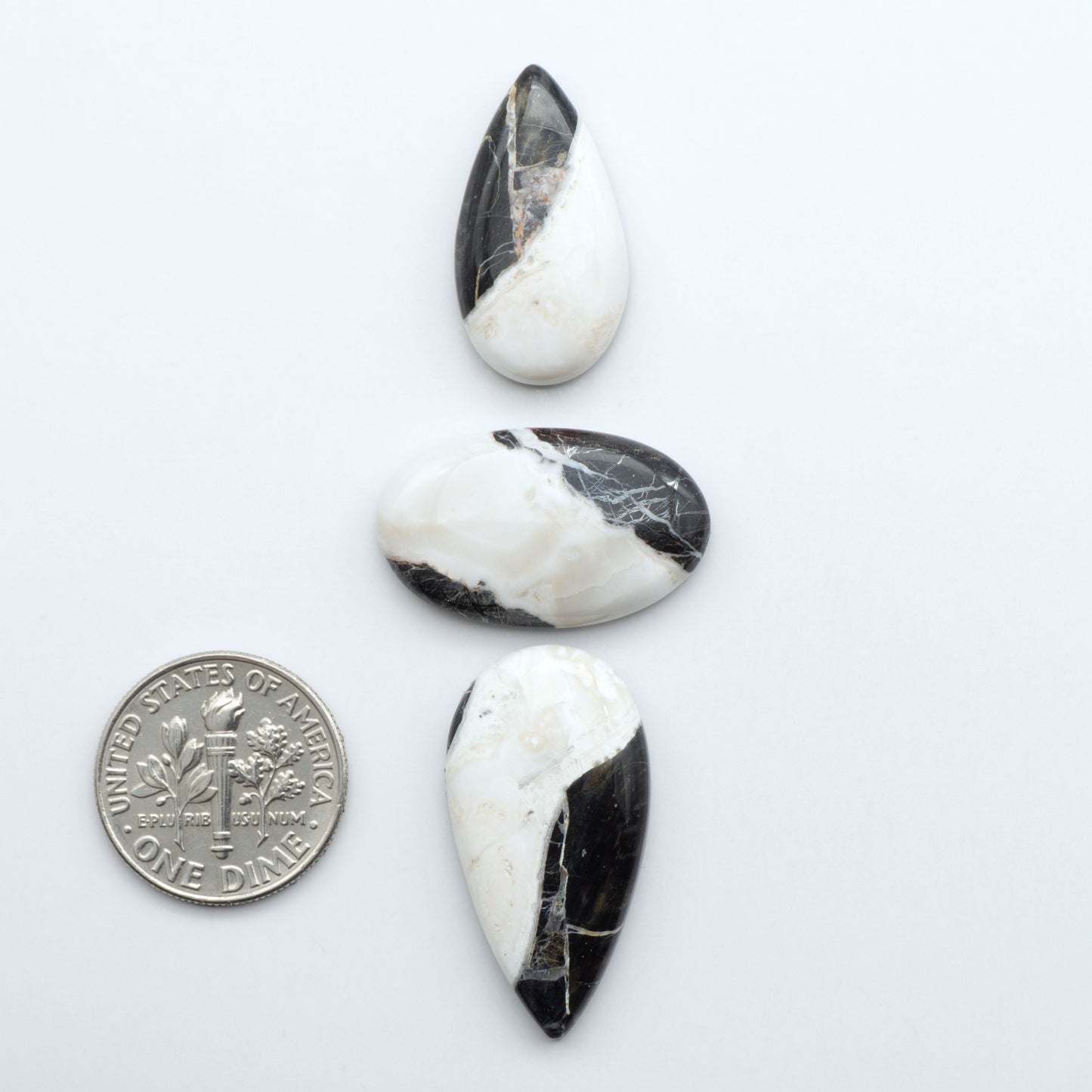 Natural White Buffalo Stone Cabochons are semi-precious gemstones cut into shapes ideal for jewelry-making, making them an excellent choice for artisans.