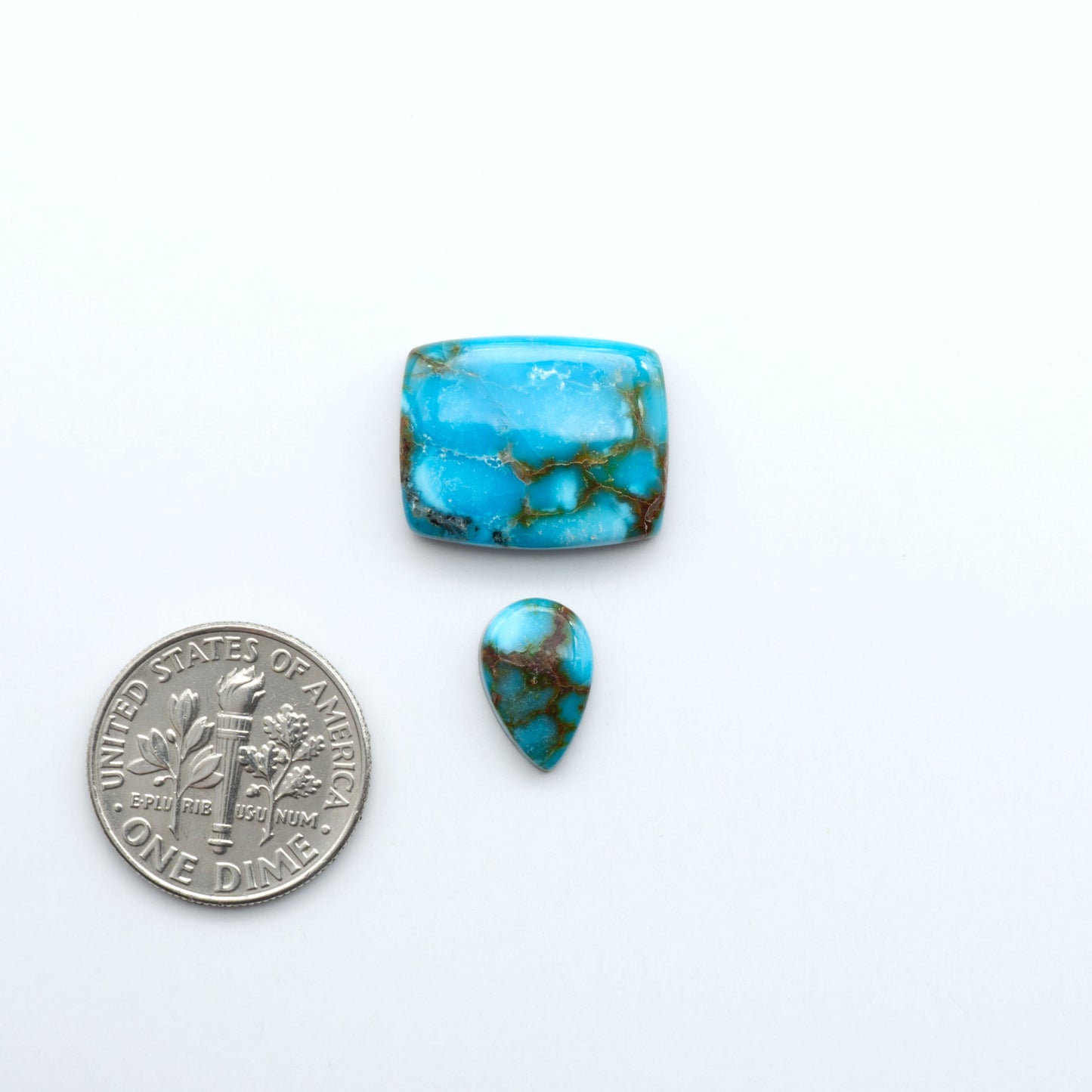 Kingman Turquoise Cabochons are a staple in the jewelry industry, known for their stunning blue-green color. Perfect for necklaces, earrings, and more!