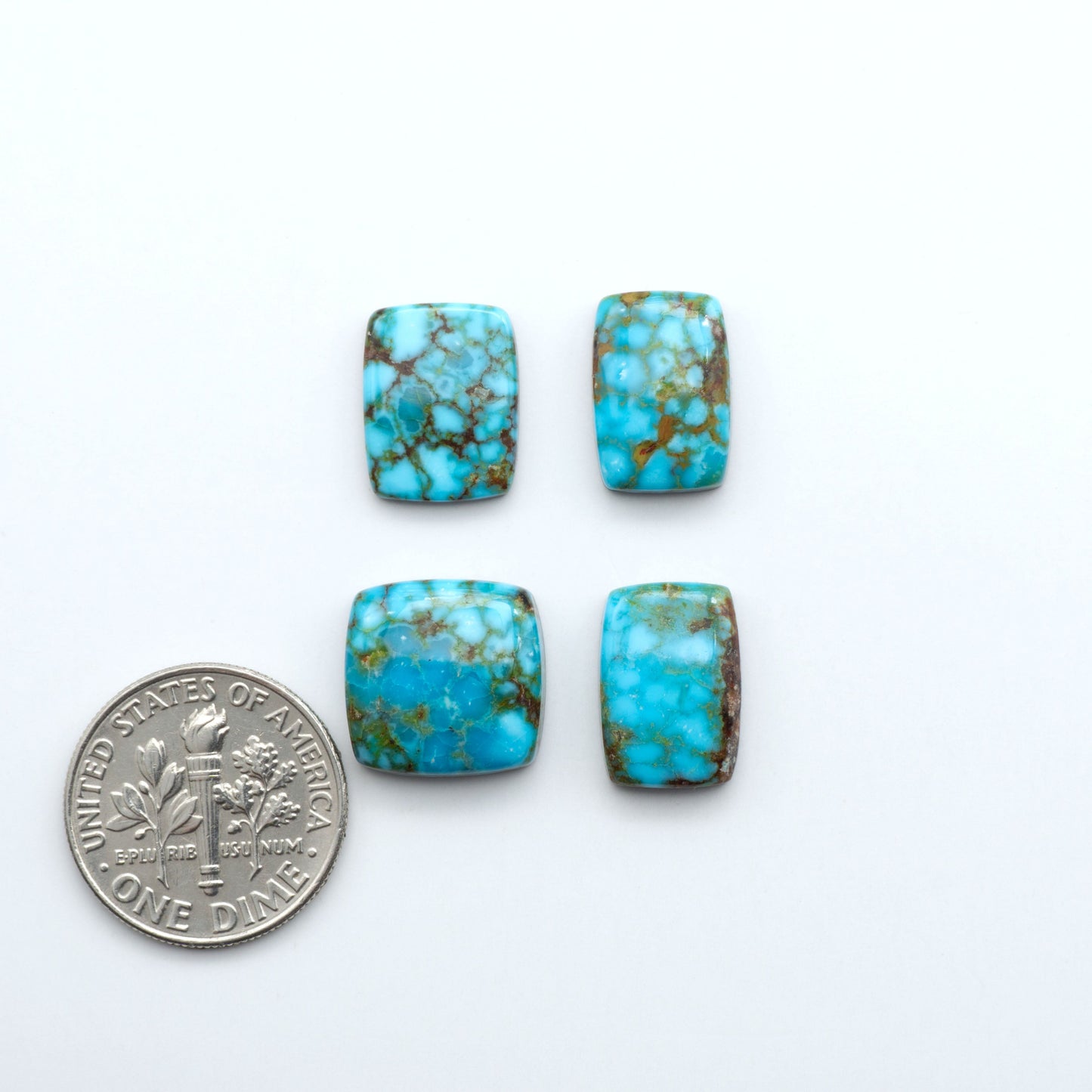 Kingman Turquoise Cabochons are a staple in the jewelry industry, known for their stunning blue-green color. Perfect for necklaces, earrings, and more!
