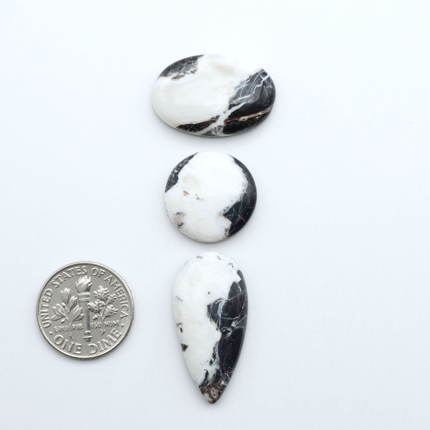 Natural White Buffalo Stone Cabochons are semi-precious gemstones cut into shapes ideal for jewelry-making, making them an excellent choice for artisans.