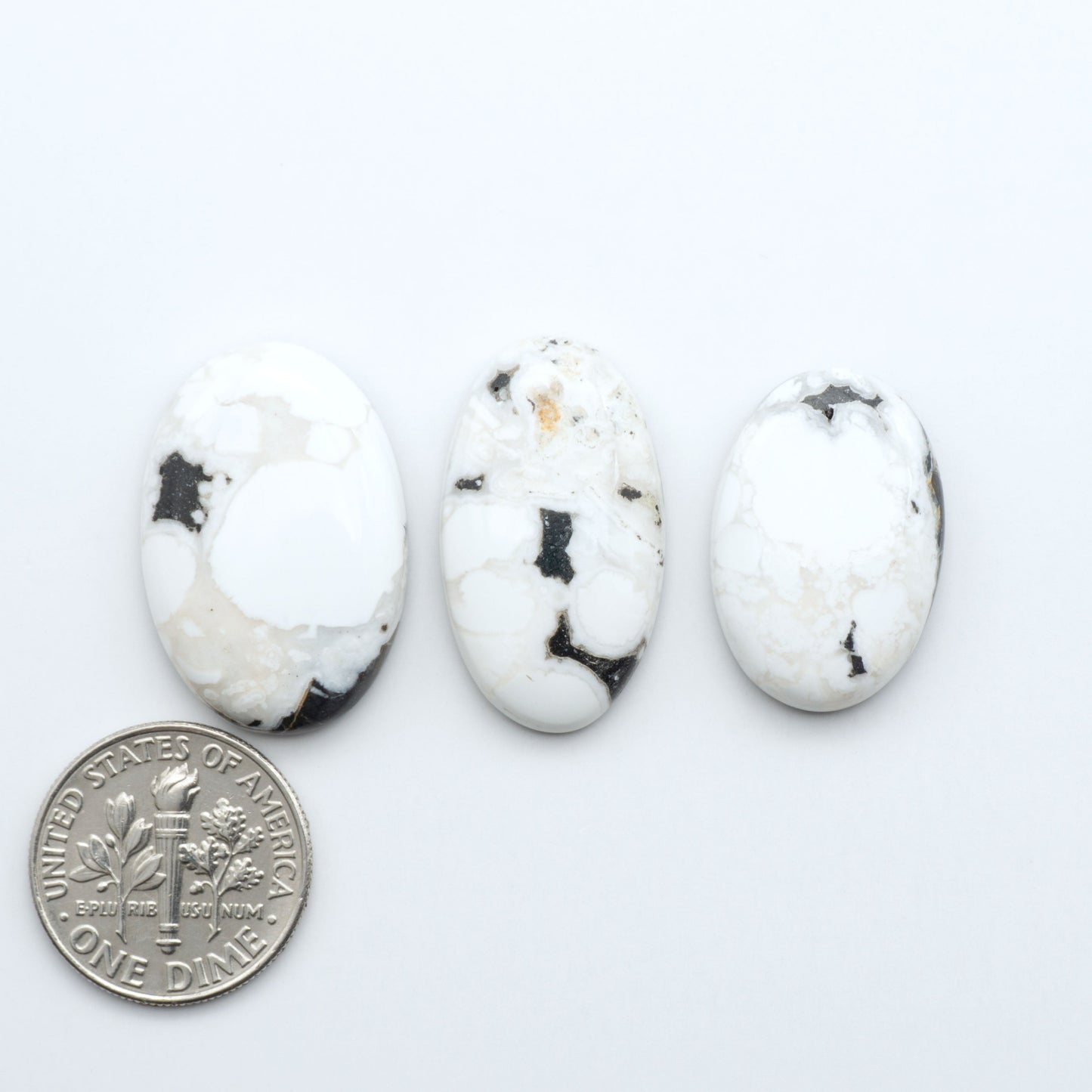 Natural White Buffalo Stone Cabochons are semi-precious gemstones cut into shapes ideal for jewelry-making, making them an excellent choice for artisans.