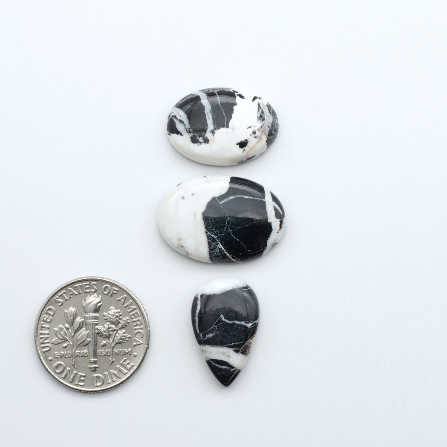 Natural White Buffalo Stone Cabochons are semi-precious gemstones cut into shapes ideal for jewelry-making, making them an excellent choice for artisans.