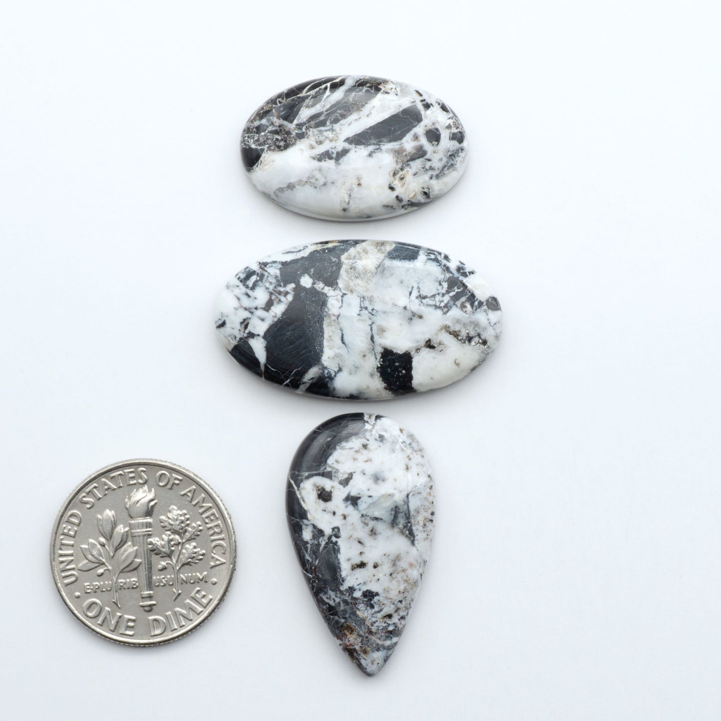 Natural White Buffalo Stone Cabochons are semi-precious gemstones cut into shapes ideal for jewelry-making, making them an excellent choice for artisans.
