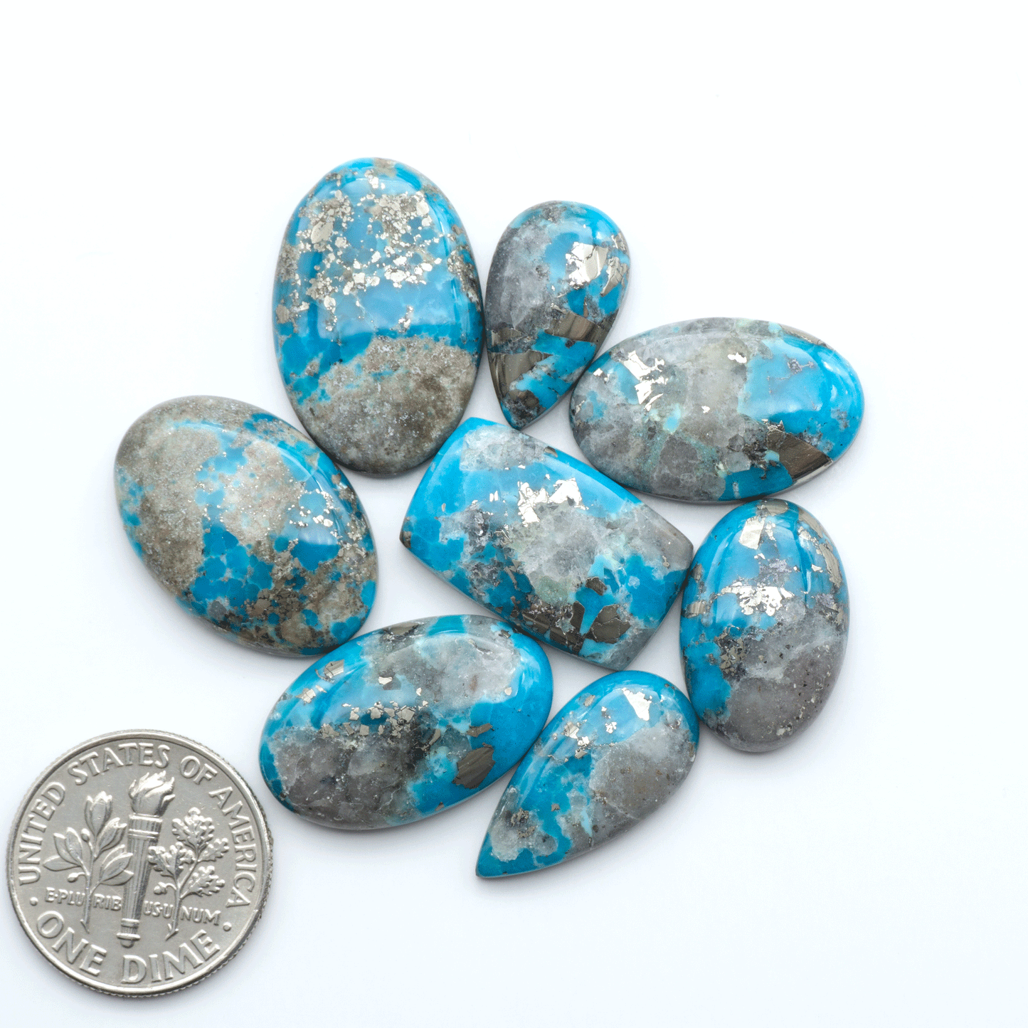 Nacozari turquoise cabochons are striking gemstones known for their vibrant blue to greenish-blue colors and pyrite, these stones are prized in jewelry making.