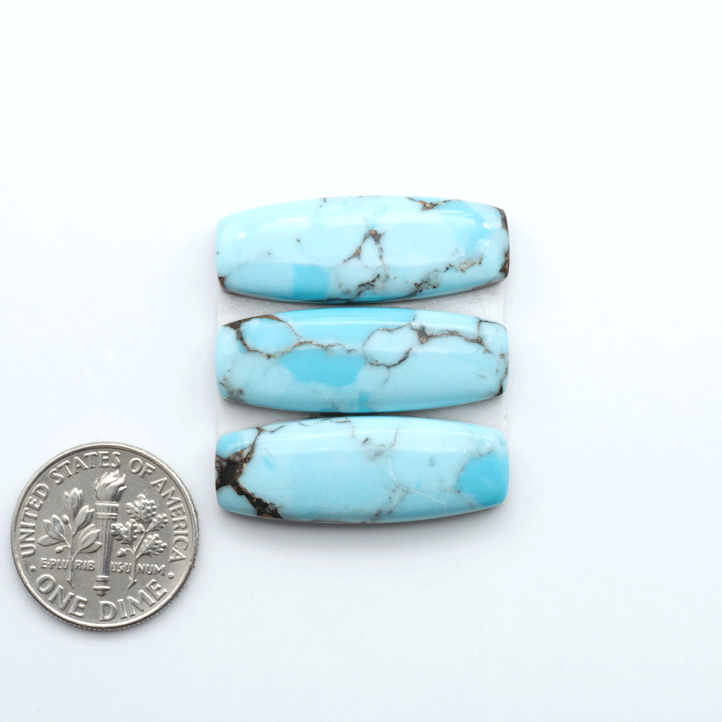 Enhance your jewelry designs with Pressed Turquoise Nugget Cabochons. Crafted from composite materials they add a captivating touch to your creations.