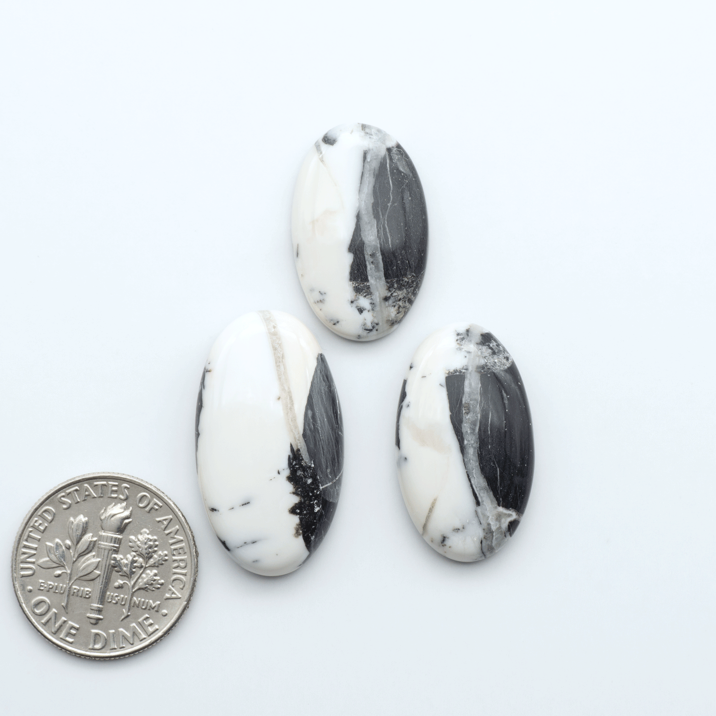 Natural White Buffalo Stone Cabochons are semi-precious gemstones cut into shapes ideal for jewelry-making, making them an excellent choice for artisans