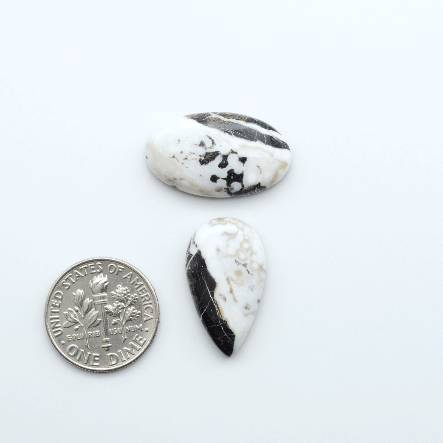Natural White Buffalo Stone Cabochons are semi-precious gemstones cut into shapes ideal for jewelry-making, making them an excellent choice for artisans