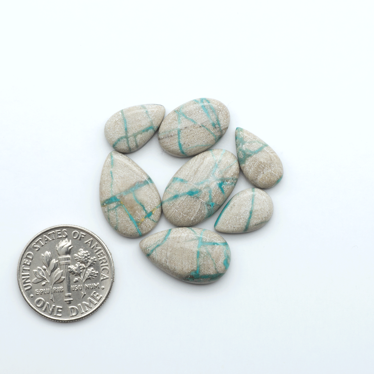 Carico Lake Turquoise cabochons with vibrant aqua-blue to turquoise tones and natural matrix, ideal for rings, pendants, and artisan jewelry.