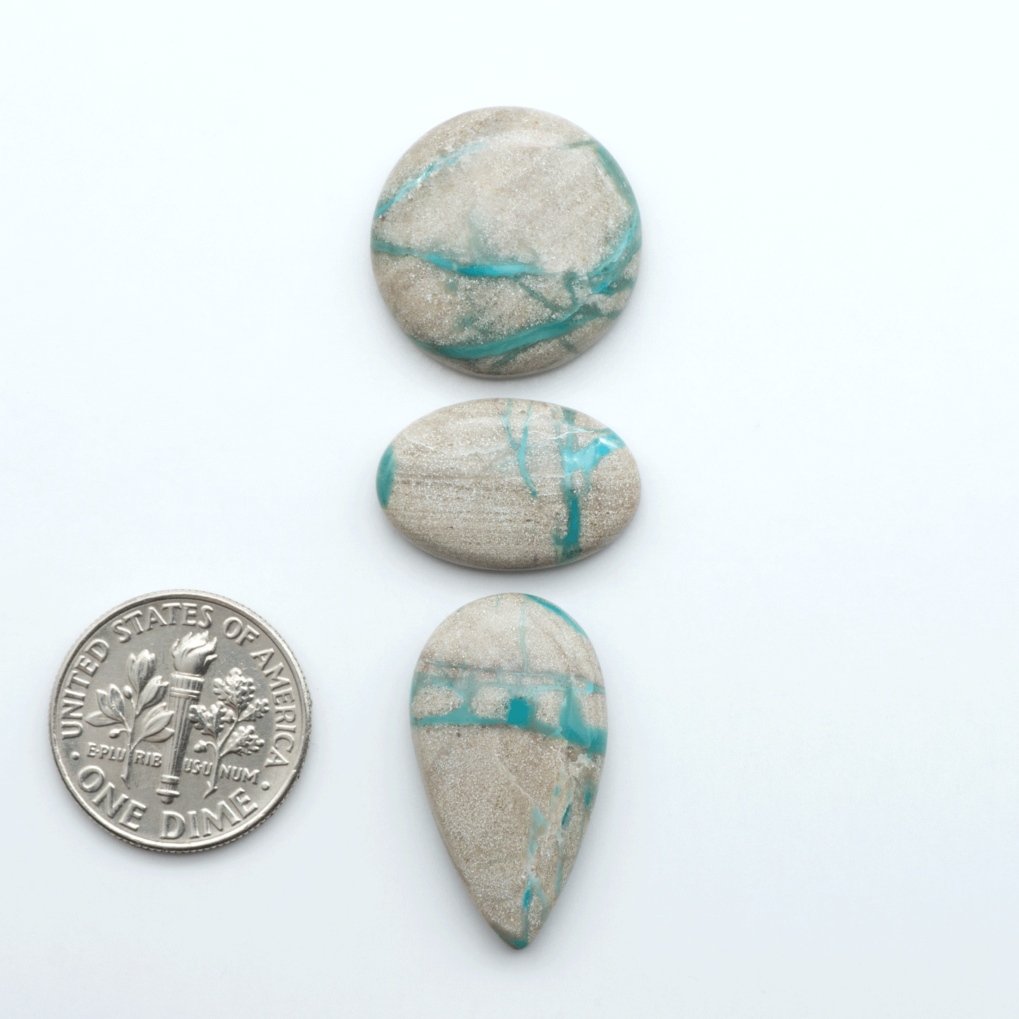 Carico Lake Turquoise cabochons with vibrant aqua-blue to turquoise tones and natural matrix, ideal for rings, pendants, and artisan jewelry.