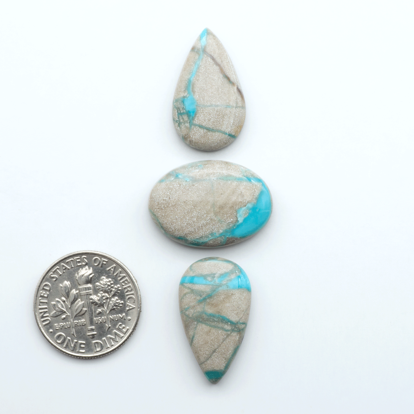 Carico Lake Turquoise cabochons with vibrant aqua-blue to turquoise tones and natural matrix, ideal for rings, pendants, and artisan jewelry.