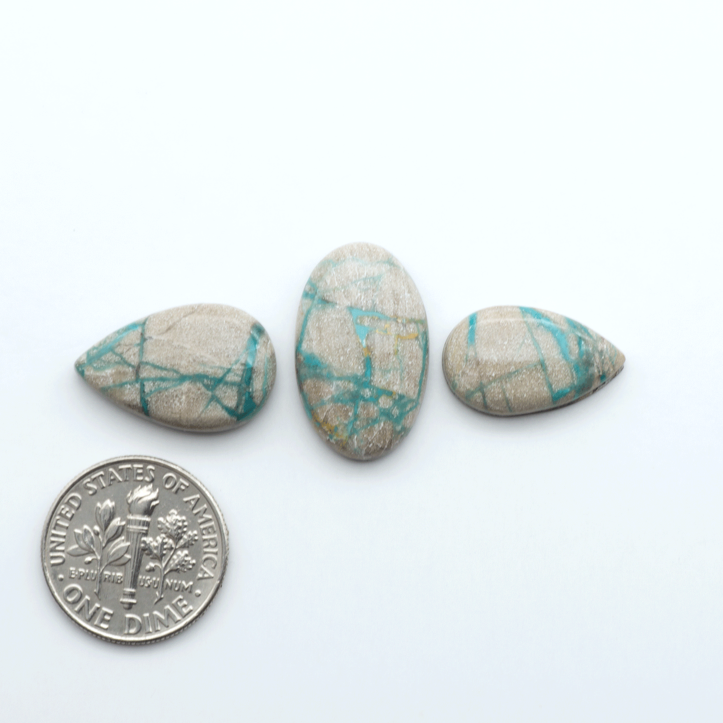 Carico Lake Turquoise cabochons with vibrant aqua-blue to turquoise tones and natural matrix, ideal for rings, pendants, and artisan jewelry.