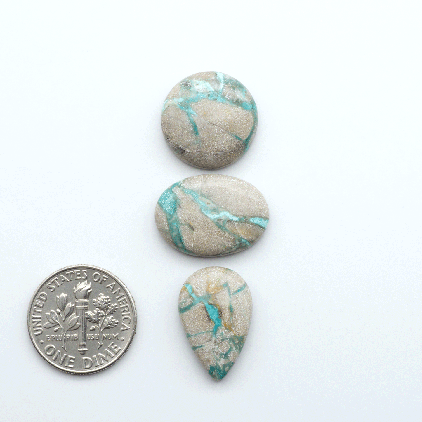 Carico Lake Turquoise cabochons with vibrant aqua-blue to turquoise tones and natural matrix, ideal for rings, pendants, and artisan jewelry.