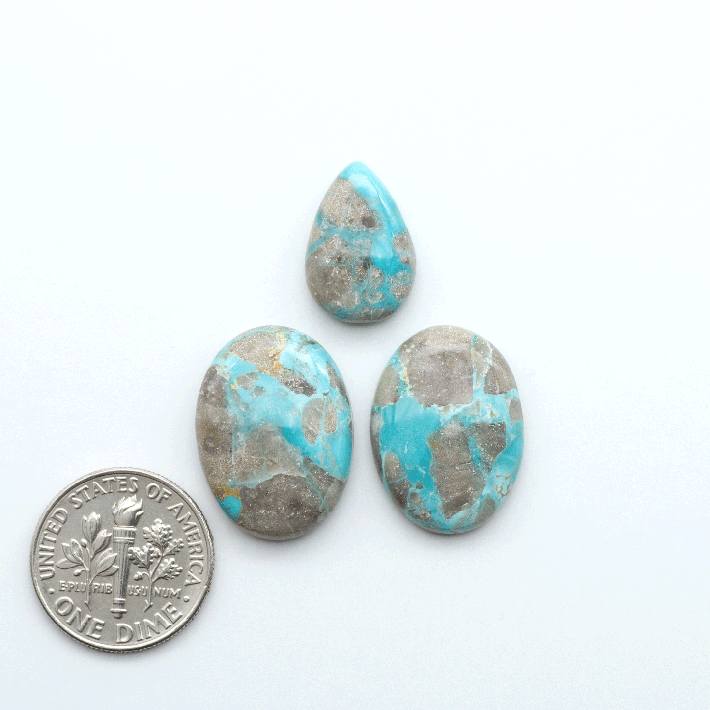 Carico Lake Turquoise cabochons with vibrant aqua-blue to turquoise tones and natural matrix, ideal for rings, pendants, and artisan jewelry.