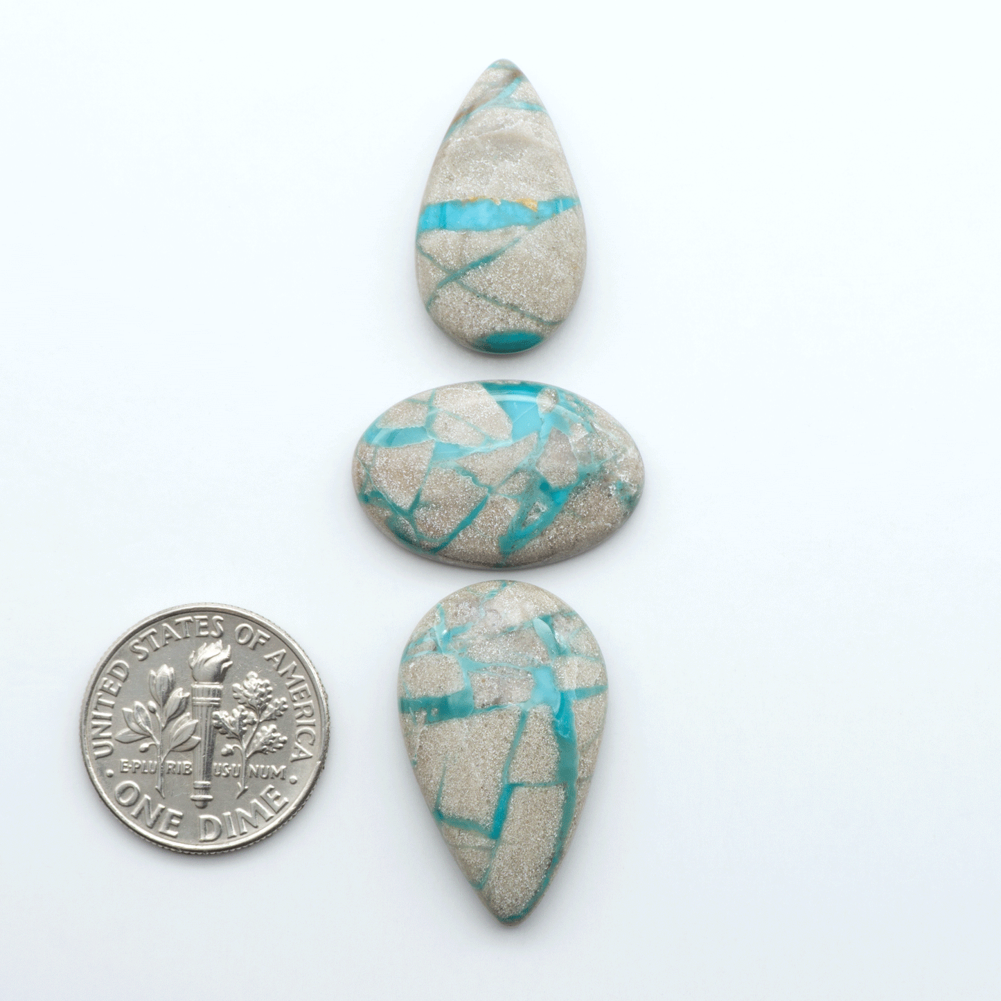 Carico Lake Turquoise cabochons with vibrant aqua-blue to turquoise tones and natural matrix, ideal for rings, pendants, and artisan jewelry.