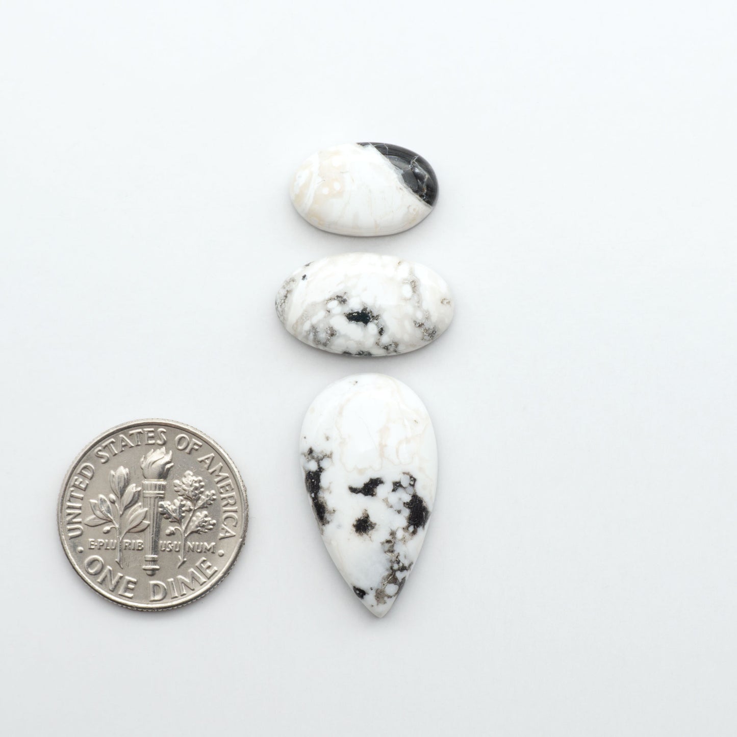 Natural White Buffalo Stone Cabochons are semi-precious gemstones cut into shapes ideal for jewelry-making, making them an excellent choice for artisans.