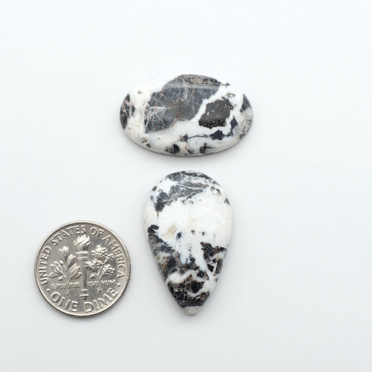 Natural White Buffalo Stone Cabochons are semi-precious gemstones cut into shapes ideal for jewelry-making, making them an excellent choice for artisans.