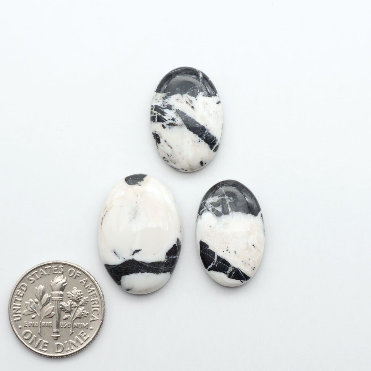 Natural White Buffalo Stone Cabochons are semi-precious gemstones cut into shapes ideal for jewelry-making, making them an excellent choice for artisans.