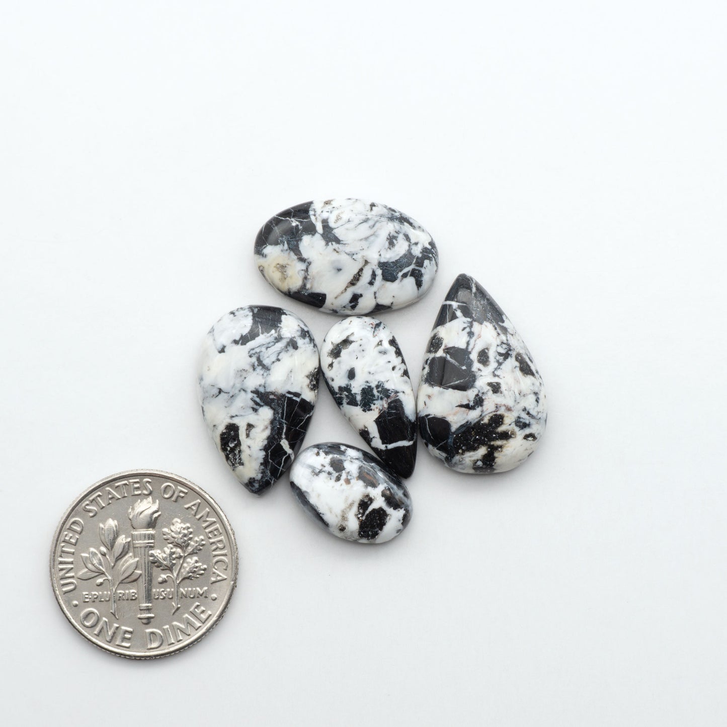 Natural White Buffalo Stone Cabochons are semi-precious gemstones cut into shapes ideal for jewelry-making, making them an excellent choice for artisans.
