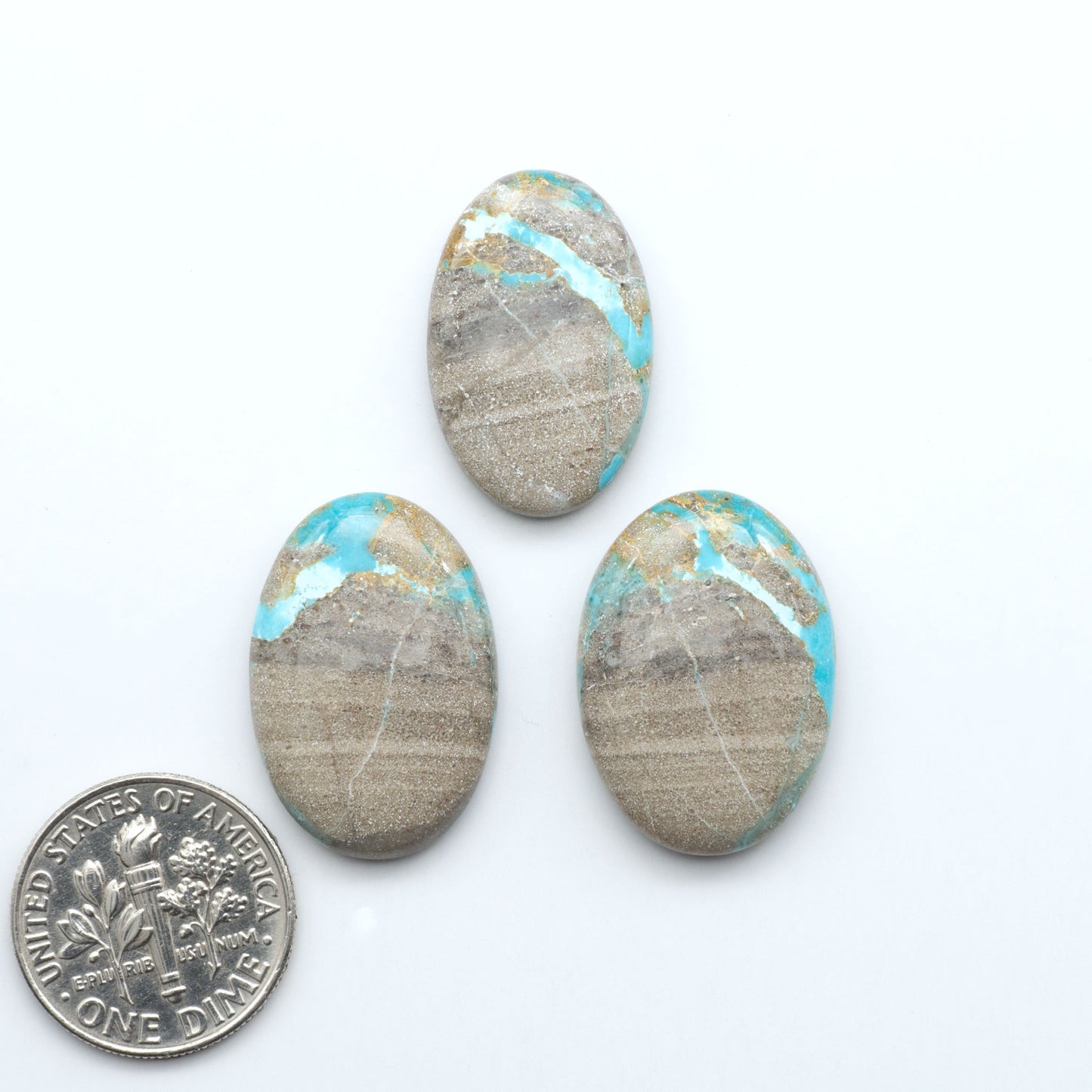 Carico Lake Turquoise cabochons with vibrant aqua-blue to turquoise tones and natural matrix, ideal for rings, pendants, and artisan jewelry.