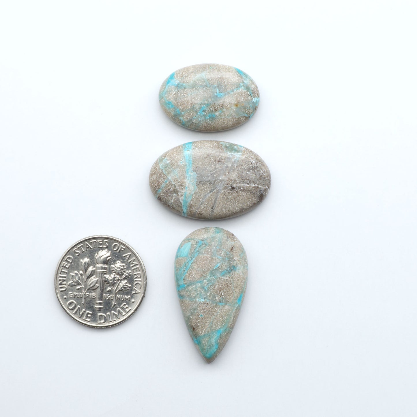 Carico Lake Turquoise cabochons with vibrant aqua-blue to turquoise tones and natural matrix, ideal for rings, pendants, and artisan jewelry.