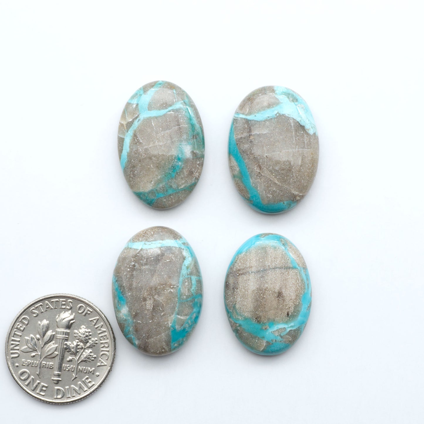 Carico Lake Turquoise cabochons with vibrant aqua-blue to turquoise tones and natural matrix, ideal for rings, pendants, and artisan jewelry.