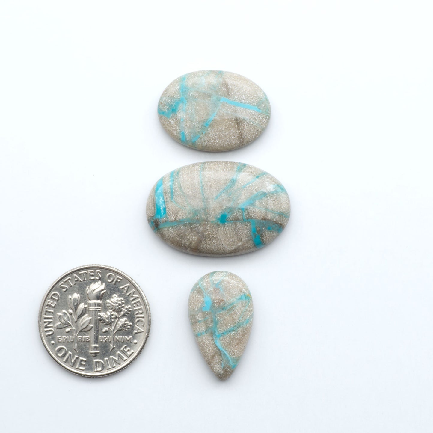 Carico Lake Turquoise cabochons with vibrant aqua-blue to turquoise tones and natural matrix, ideal for rings, pendants, and artisan jewelry.