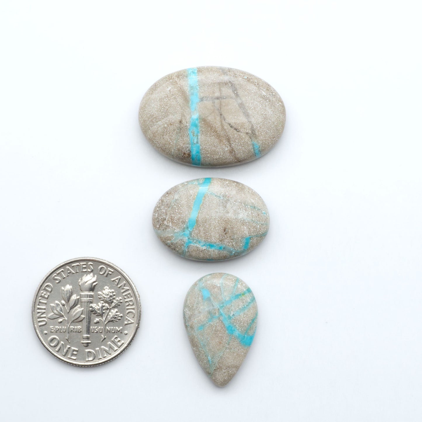 Carico Lake Turquoise cabochons with vibrant aqua-blue to turquoise tones and natural matrix, ideal for rings, pendants, and artisan jewelry.